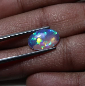 Cabochon ovale 3,2 Cts 15,5x10 MM vero AAA arcobaleno fuoco nido d'ape opale etiope - Foto 1 di 9