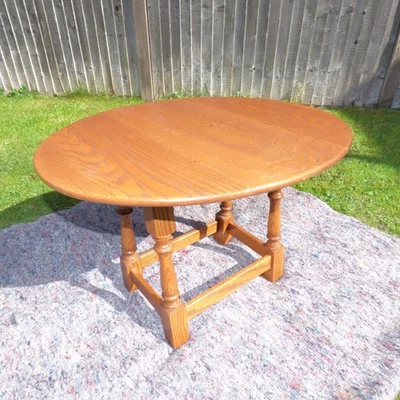 Jaycee Oval Oak Swivel Twist Top Drop Leaf Occasional Side Table - Image 1 of 4