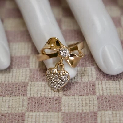 ESTATE 14KYG BOW RING WITH NATURAL MINED PAVE DIAMOND DANGLING HEART (size 7) - Image 1 of 4