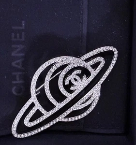 CHANEL Saturn motif brooch Silver With Clear Crystals - Picture 1 of 5