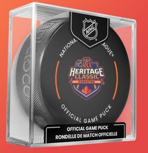 2023 HERITAGE CLASSIC GAME PUCK WITH DISPLAY CUBE 20TH ANNIVERSARY OILERS FLAMES