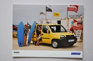 Car Press Photo - Fiat Doblo - Light Yellow - Side / Front View - Picture 1 of 1
