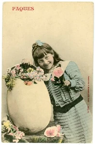 Postcard -  Paques (Easter), Girl with Large Egg & Flowers, Hand-Colored, French - Picture 1 of 2