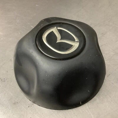 Оригинальный черный центральный колпак колеса 98-03 Mazda B3000 B4000 F67A-1A096-KA F67A-1A096-MA - Изображение 1 из 4