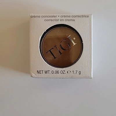 Corrector TIGI Cosmetics Crème DARK 0,06 oz Foto 1 de 4