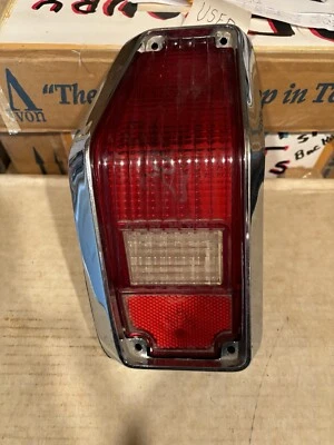 1971-1973 Chevrolet Vega LH Stop And Tail Light Lens With Chrome Trim - Image 1 of 4