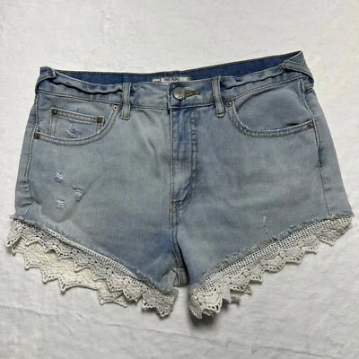 Pantalones cortos de mezclilla Free People ribete de encaje desgastados lavado claro para mujer talla 27 Foto 1 de 4