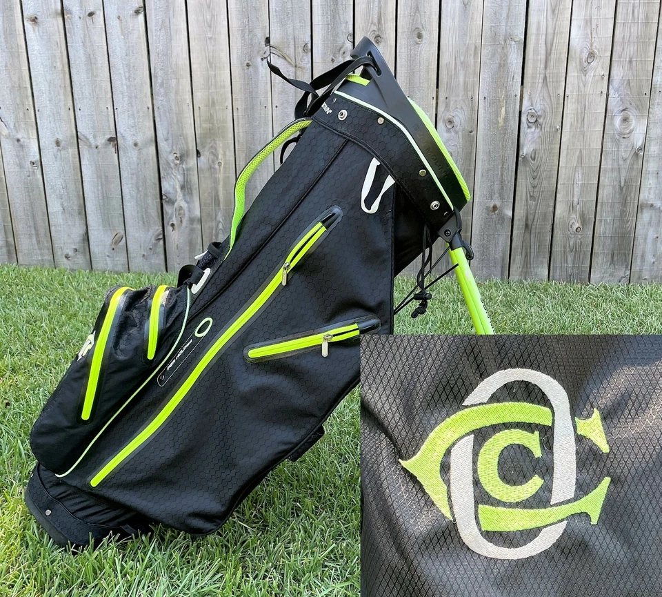 Bolsa de golf OAKMONT COUNTRY CLUB Sun Mountain de transporte/soporte (negra) H2 no impermeable Foto 1 de 4
