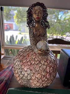 art sculpture piece of lady holding the world in her hands - Picture 1 of 1