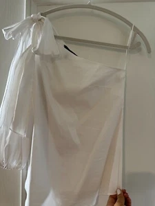 NWE WHITE HOUSE BLACK MARKET ONE SLEEVE  WHITE SIZE 0 BLOUSE TOP - Picture 1 of 6