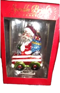 CHRISTOPHER RADKO 2012 VETRO SOFFIATO BABBO NATALE IN AUTO ORNAMENTO SCINTILLANTE LUMINOSO NUOVO CON SCATOLA HTF - Foto 1 di 11