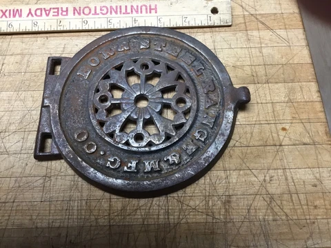 Vintage antique Born Steel Range Co. grate / cast iron fold down trivet Cover