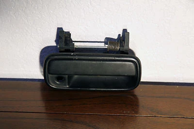 Manija de puerta exterior de pasajero camioneta Toyota 1989-1995 original OEM 69293-33010 Foto 1 de 4