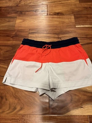 Шорты Athleta размер 10 красные синие и желтовато-коричневые с карманами - Изображение 1 из 3