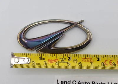 2002-2004 OLDSMOBILE BRAVADA REAR GOLD EMBLEM SYMBOL BADGE OEM - Image 1 of 4