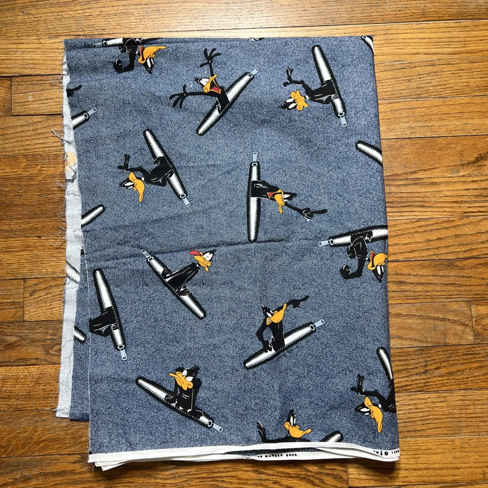 Daffy Duck, zippers on denim look background from Warner Brothers 43.5x62.5 - Image 1 of 1