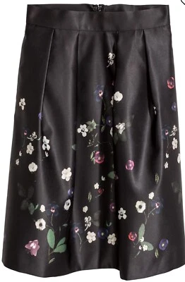 Falda H&M Círculo Satinado en Negro con Estampado Floral Violeta, Talla 6 Foto 1 de 4