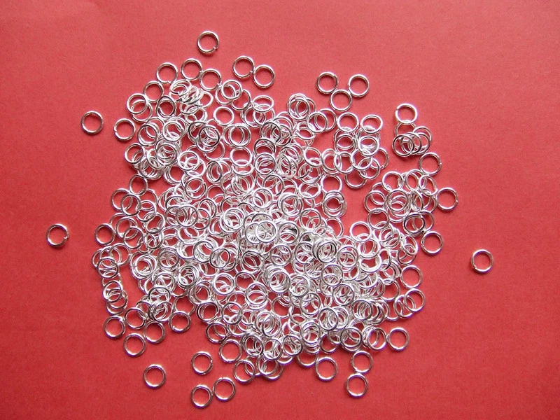 200 pz anellini in metallo colore argento chiaro 5x0.69mm bijoux - Immagine 1 di 1