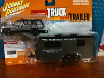 2023Johnny Lightning 1:64 1997 Chevrolet Tahoe with Camper Trailer (Gray) Police - Image 1 of 4