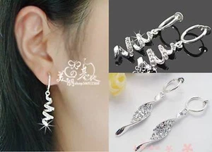 1 PAIR CLIP-ON SILVERTONE/DIAMANTE TWIST DANGLE EARRINGS - Picture 1 of 4