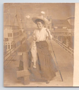 RPPC Young Woman with Fishing Pole and Big Fish Catch Studio Postcard - Picture 1 of 5