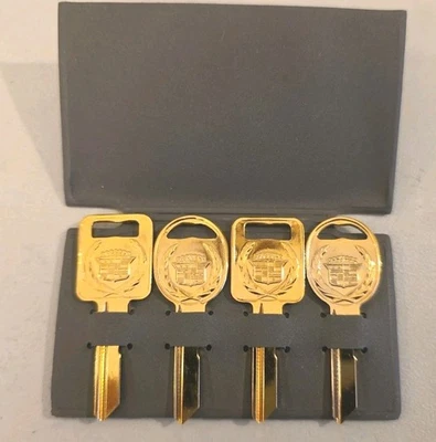Vintage of 4 Uncut Gold Cadillac Keys In Gray Sleeve Vintage New Auto Parts - Image 1 of 4