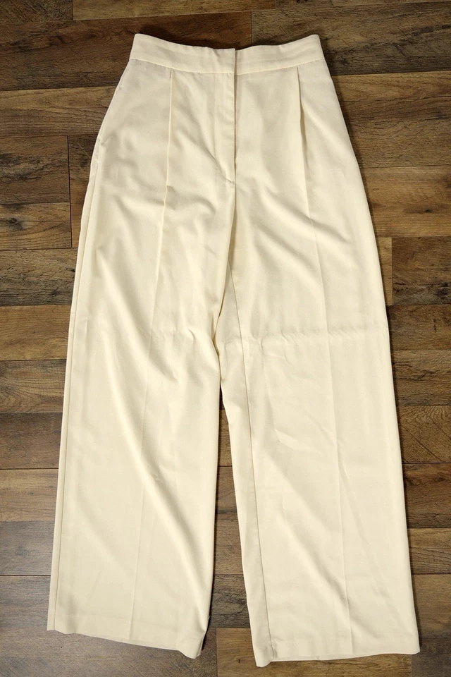 Pantalones de vestir plisados de moda Zara para mujer S marfil cintura alta pierna ancha con bolsillos Foto 1 de 4