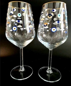 (237) Set di 2 bicchieri da vino Rakle per Anthropologie "Occhi attenti" bordo oro - Foto 1 di 3