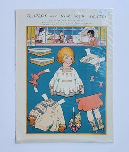 NANCY UND IHRE NEUEN SCHLITTSCHUHE VINTAGE 1924 PAPIERPUPPE SELTEN ZU FINDEN.  - Bild 1 von 3