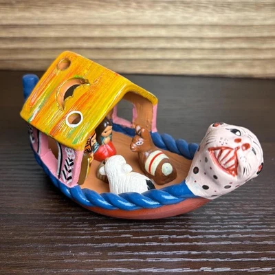 Handmade Peruvian Clay Nativity in Canoe White Jaguar Christmas Decoration - Image 1 of 4