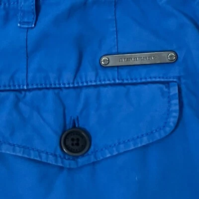Pantalones cortos Burberry para niños con logotipo azul real 100 % algodón frente plano talla 8 Foto 1 de 4