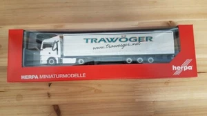 Herpa 311779 - 1/87 MAN TGX XLX Rimorchio Con Tende Trawöger - Foto 1 di 1