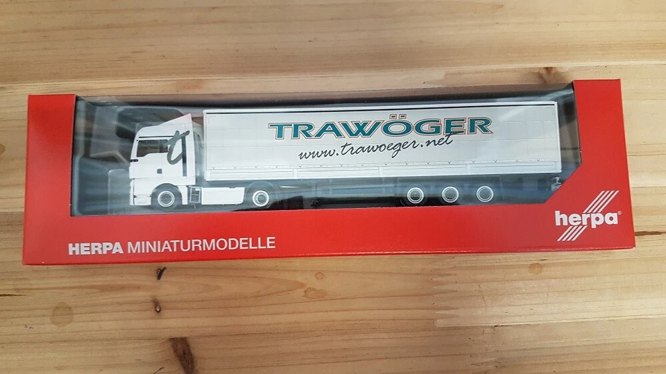 Herpa 311779 - 1/87 MAN TGX XLX Rimorchio Con Tende Trawöger - Immagine 1 di 1