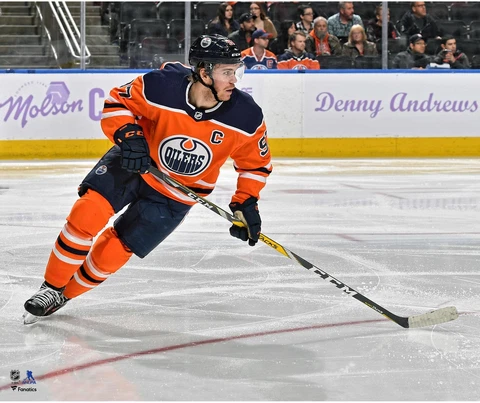Connor McDavid Edmonton Oilers Unsigned Orange Jersey Skating Photograph Cover