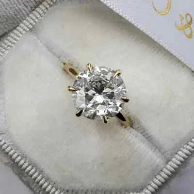 Anillo de compromiso solitario de diamantes redondo creado en laboratorio de 1 quilate enchapado en oro amarillo de 14 K Foto 1 de 4