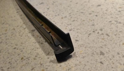 NICE USED ORIGINAL PORSCHE 911 TARGA BLACK DRIVERS DOOR WINDOW CHANNEL GUIDE - Image 1 of 4