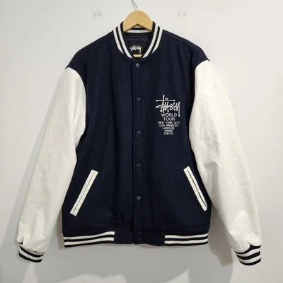Chaqueta de bombardero universitaria Stussy World Tour para hombre talla XL azul y blanco ropa de calle  Foto 1 de 4