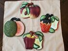 A Set Of Four Ceramic Fruit Wall Plaques