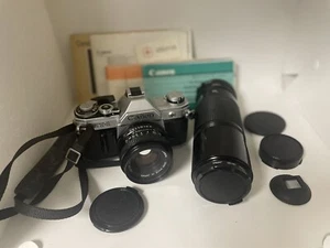 Canon AT-1 35mm Film Camera Bundle With 50mm Lens, Case & Books - Picture 1 of 11