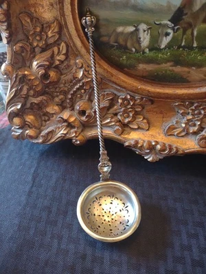 Cucharón colador danés de plata de ley mango largo con cara Foto 1 de 4