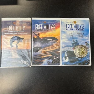 Free Willy 1, 2 and 3 VHS Clamshell VHS Tapes With Whale Pendant and Compass - Picture 1 of 8