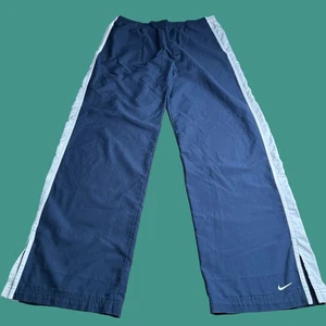 Pantalones deportivos Nike jóvenes grandes negros Y2K cortavientos holgados patinador atléticos - Imagen 1 de 12