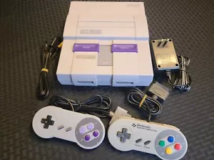 Consola de sistema Super Nintendo SNES con 2 mandos, cables de CA y A/V, Mario opt - Imagen 1 de 60