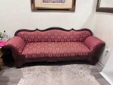 Hand Carved Antique Victorian sofa settee with wooden casters- Good Condition