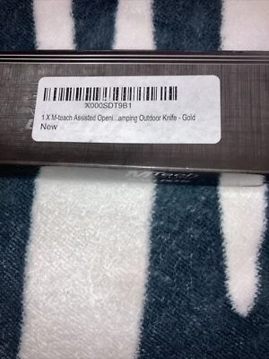 Navaja de bolsillo plegable M-Tech MTA705GD Linerlock apertura asistida - dorada Foto 1 de 4