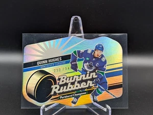 2023-24 Parkhurst Champions QUINN HUGHES #BR-25 Burnin Rubber Gold /349 - Bild 1 von 2