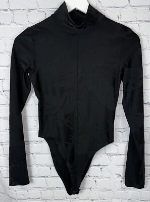 NIKE Tech Pack Mujer Body Negro Floral Jacquard Cuello Alto Talla XS Foto 1 de 4