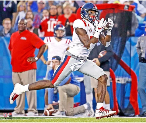 DK Metcalf Ole Miss Rebels Unsigned White Jersey Running Photograph Cover