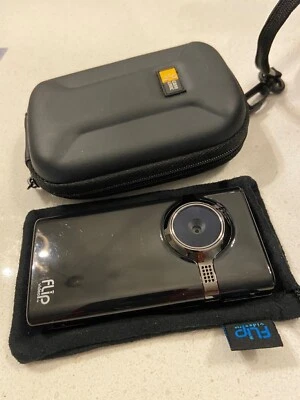 Flip Video MinoHD F460 Camcorder with protective sleeve case and hard outer case - Image 1 of 3