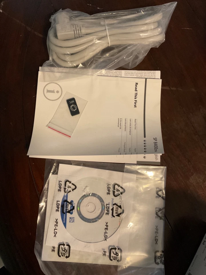 Ricoh  SP 8400DN  POWER CORD , MANUAL AND CD - Image 1 of 1